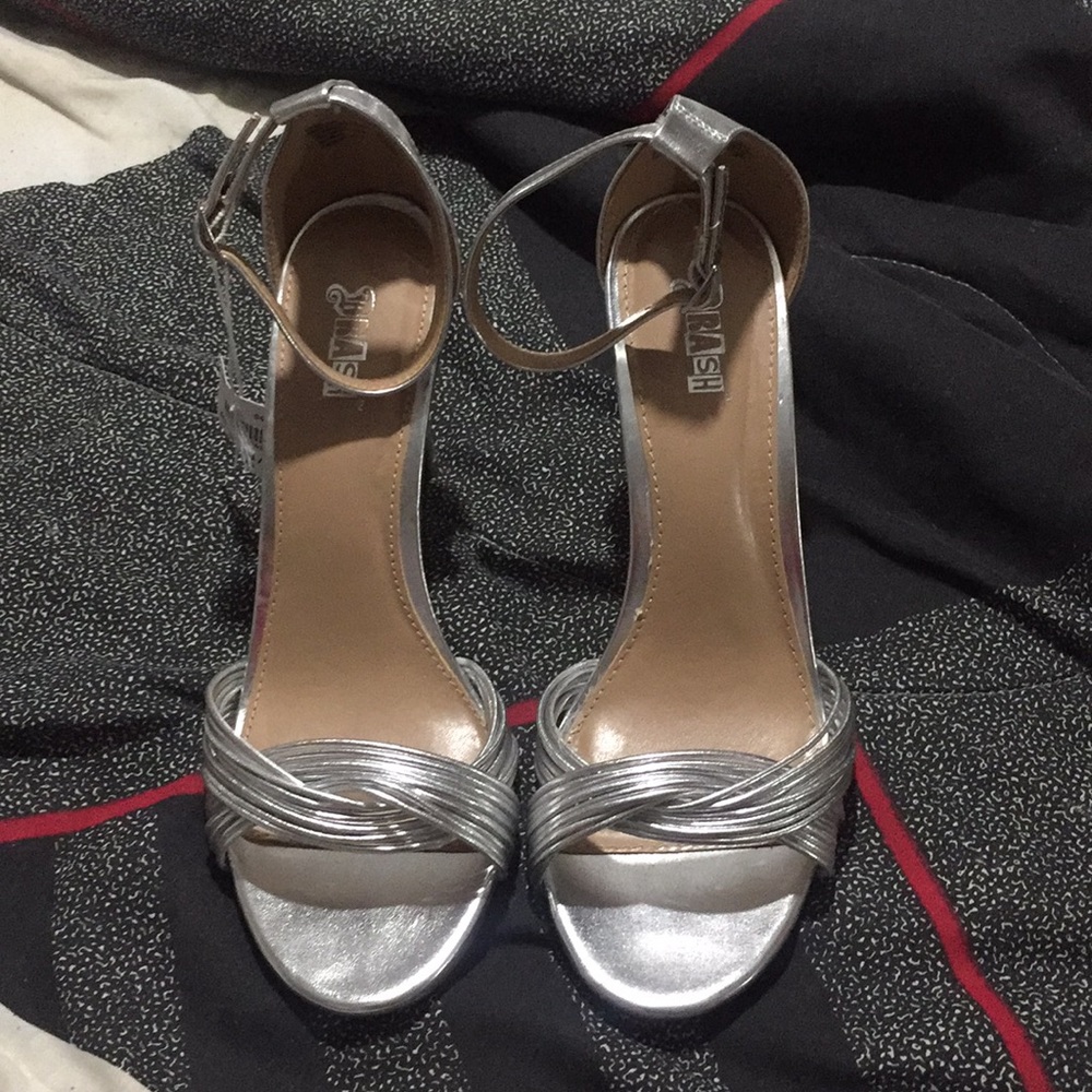 Brand new silver high heels size 9 1/2